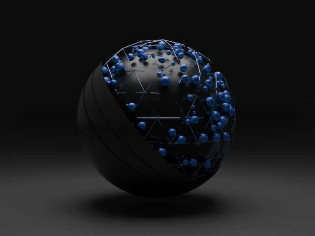 Black ball with exposed hardware and blue spheres in the exposed areas